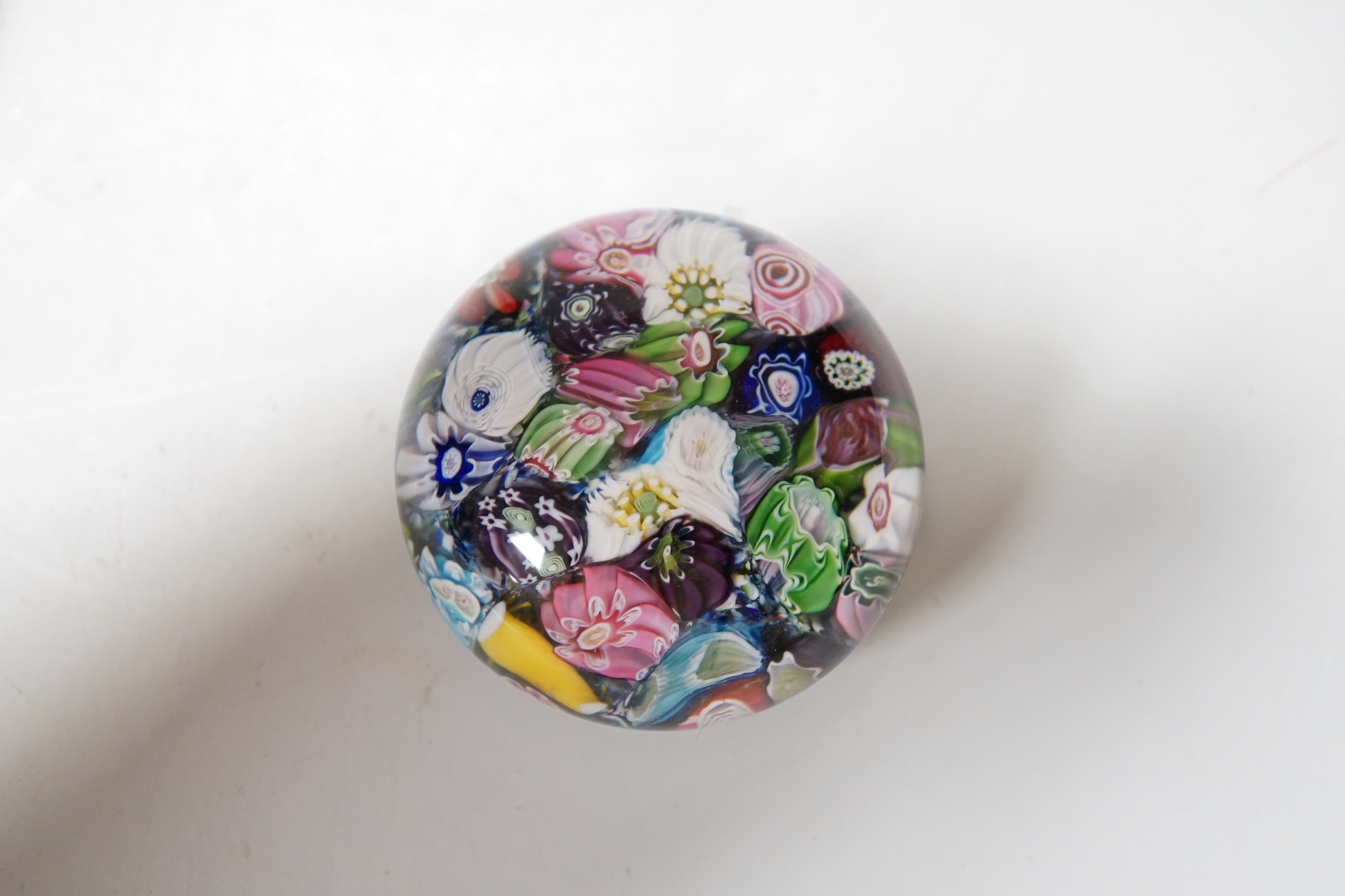 A Clichy scrambled cane paperweight, 5cm diameter